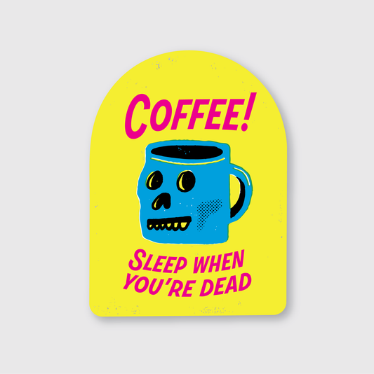 Skull-shaped coffee cup with 'Coffee! Sleep when you're dead' text on a yellow background