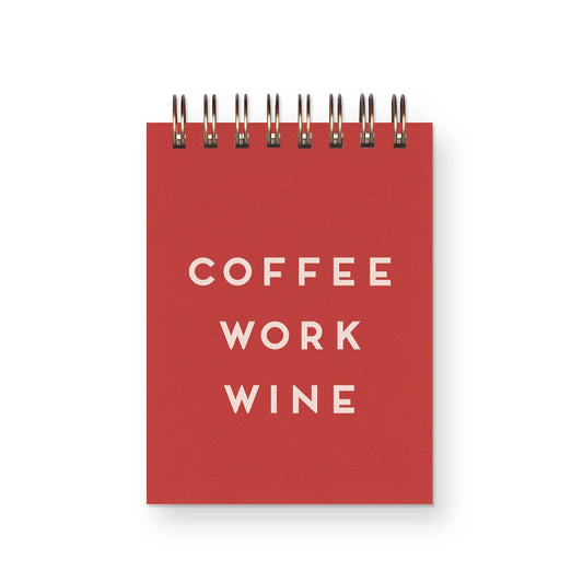 Red mini notebook with 'COFFEE WORK WINE' text on a white background