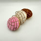 all 3 concha keychains in pink, white and brown 