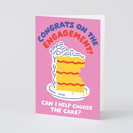 Congratulatory engagement card with an illustration of a slice of cake with a bite taken out of it. Text reads "Congrats on the engagement! Can I help choose the cake?"