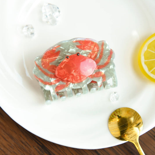 hair claw that looks like a crab on a white plate 