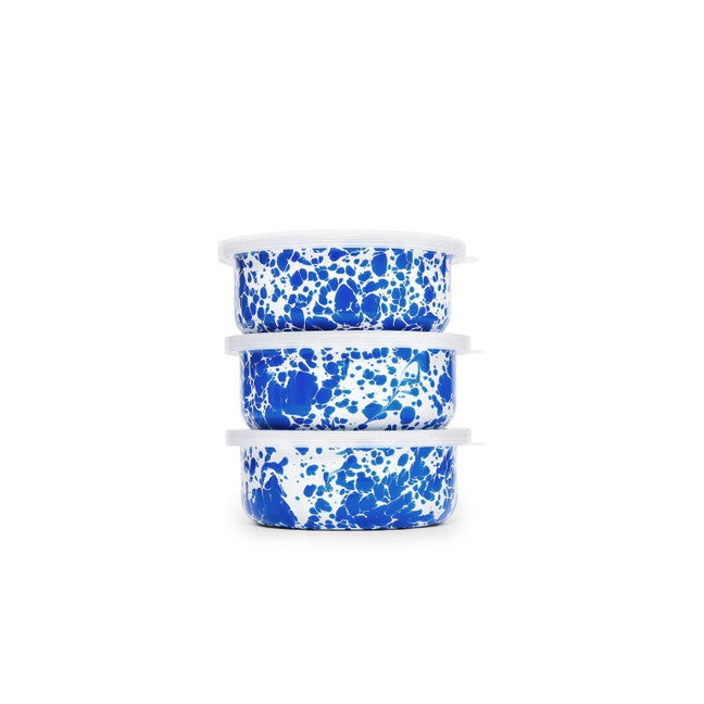 Stack of 3 enamel storage bowls with lids. Blue splatter pattern throughout. 