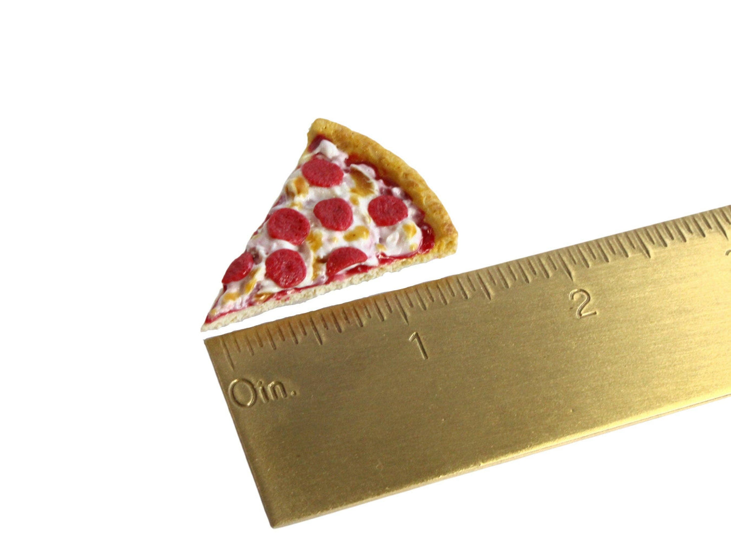 Handmade magnet shaped like a single slice of pepperoni pizza. Shown next to a ruler for size comparison.
