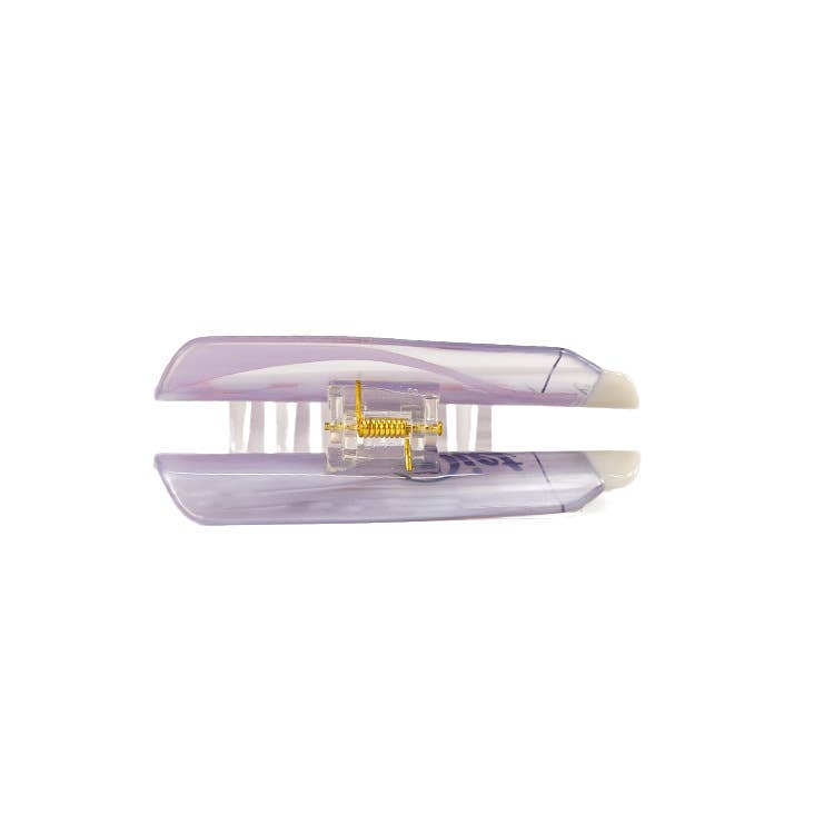 Side view of diet coke can shaped hair claw on a white background