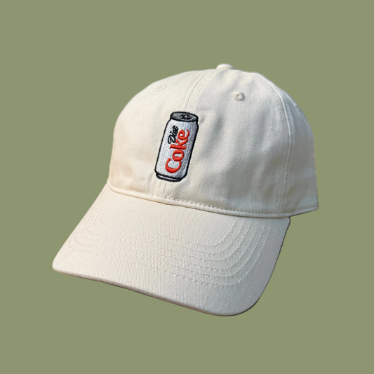 White cap with a Diet Coca-Cola can logo on a green background