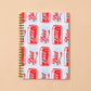 Notebook with Diet Coke can pattern on a beige background