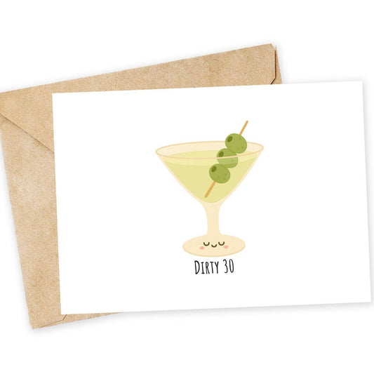 Greeting card with a cocktail illustration and 'Dirty 30' text, accompanied by a kraft envelope on a white background.