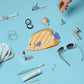Collection of small items including a fish-shaped pouch, sunglasses, and lip products on a blue background