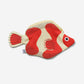 Red and beige clownfish-shaped pouch on a white background