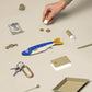 Flat lay of herring fish pouch with other various small items for scale 