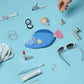 Collection of small items including a fish-shaped pouch, sunglasses, and lip products on a blue background