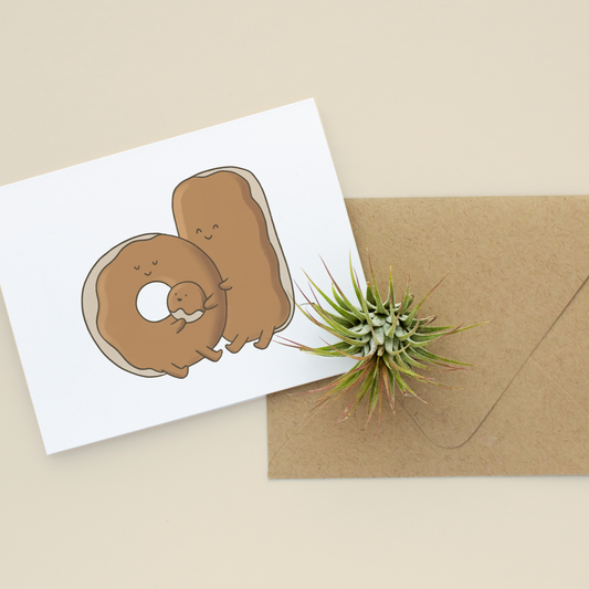 Greeting card with a donut illustration and a brown envelope on a beige background