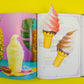 Open book with ice cream cone bookmarks on a page 
