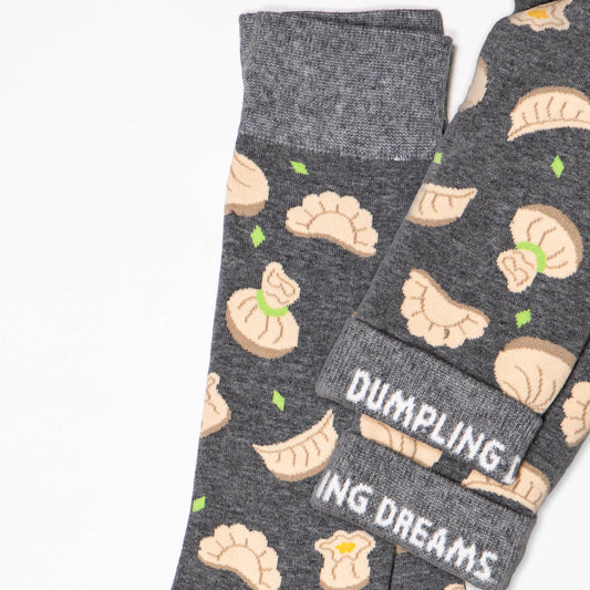 dark grey socks with dumpling pattern all over it 