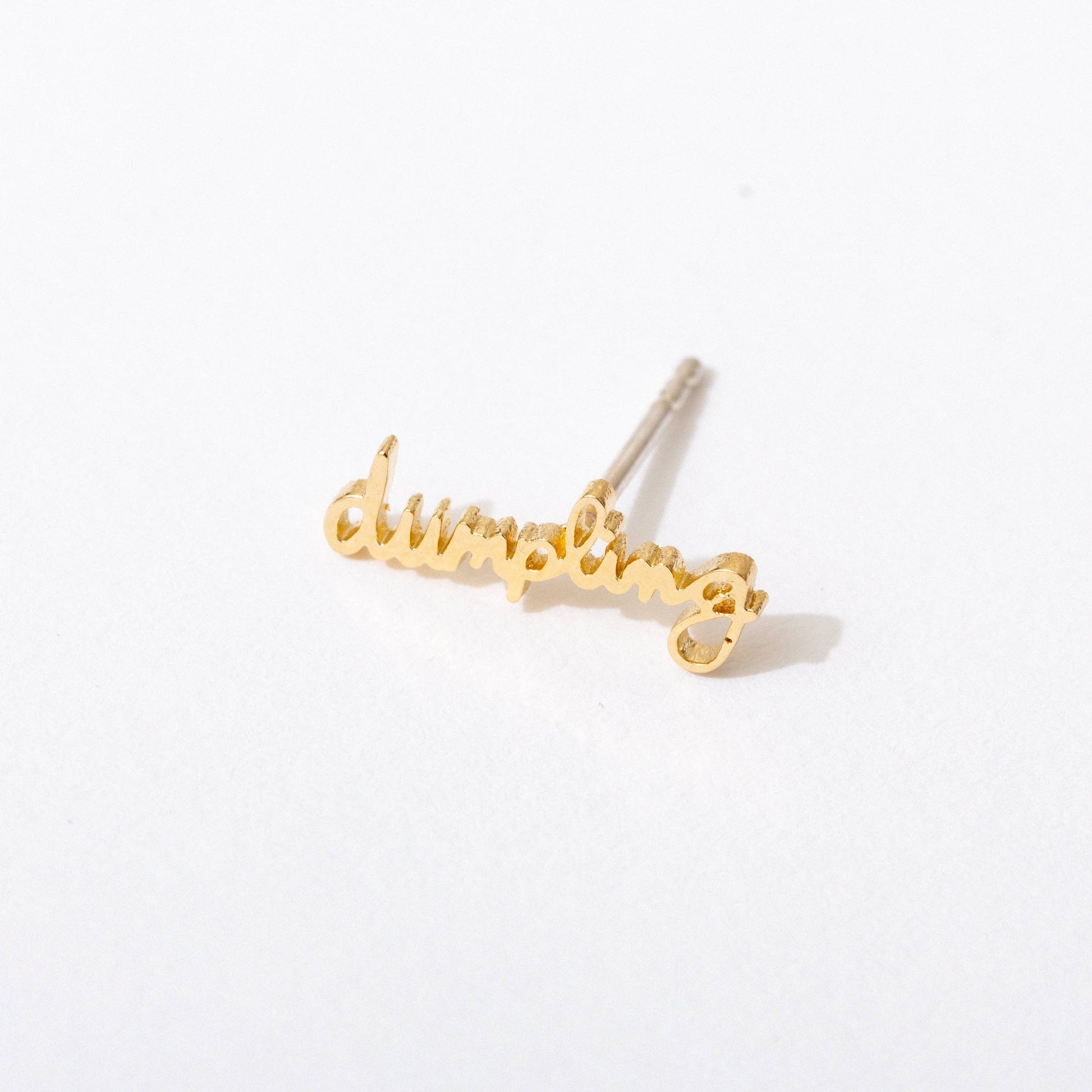 Single 14k gold plated stud earring -- reads "dumpling" in handwritten script