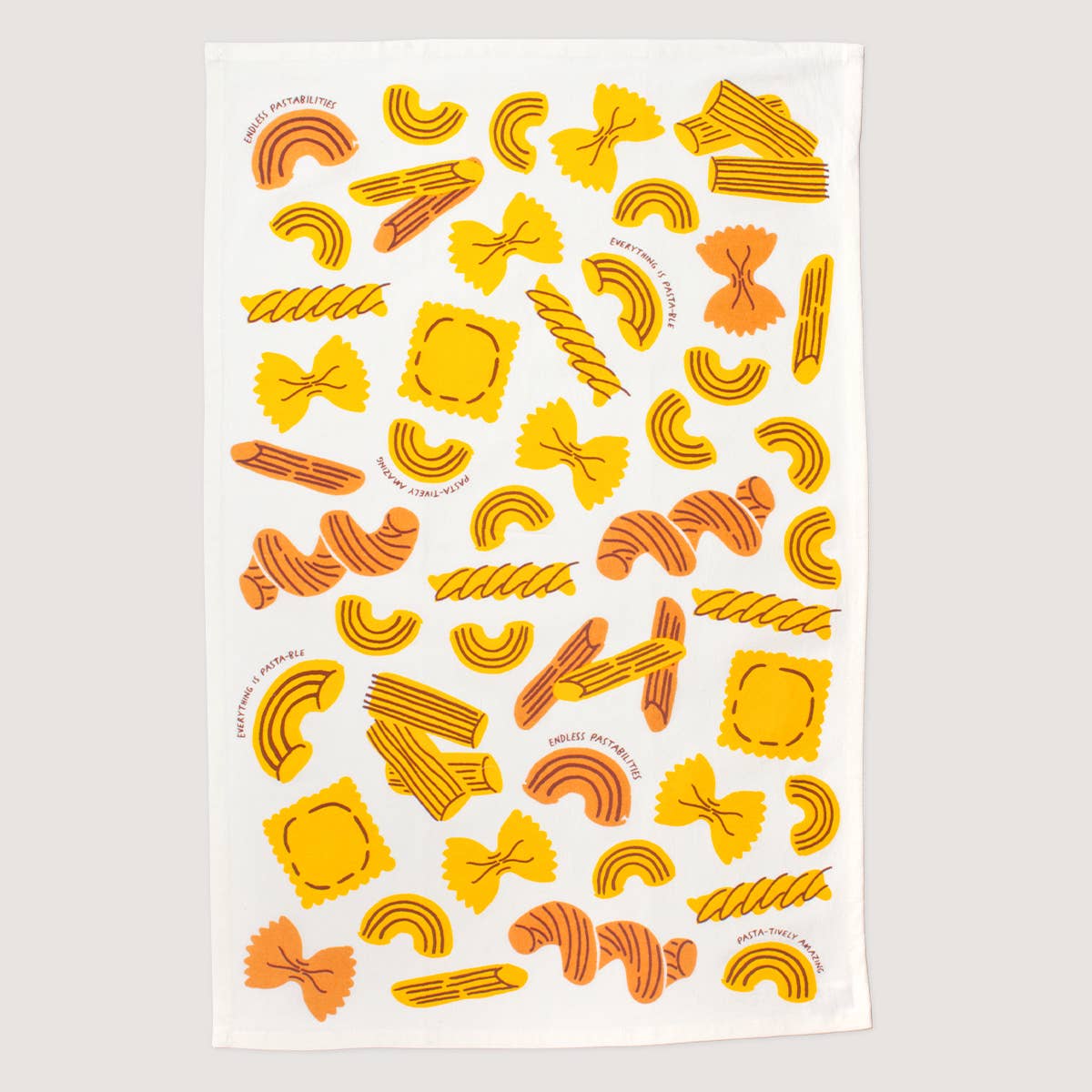 Kitchen towel with assorted pasta shapes and pasta puns which include "endless pastabilities", "everthing is pastable", and "pasta-tively amazing".