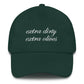 Green cap with 'extra dirty extra olives' text on a white background