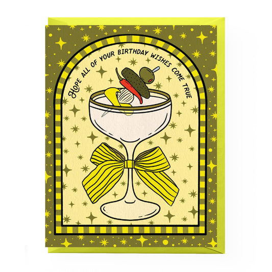 Greeting card with a dirty martini cocktail illustration and birthday wishes text on a yellow and green background.