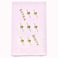 White kitchen towel with olive skewer design and text "extra dirty" on a white background