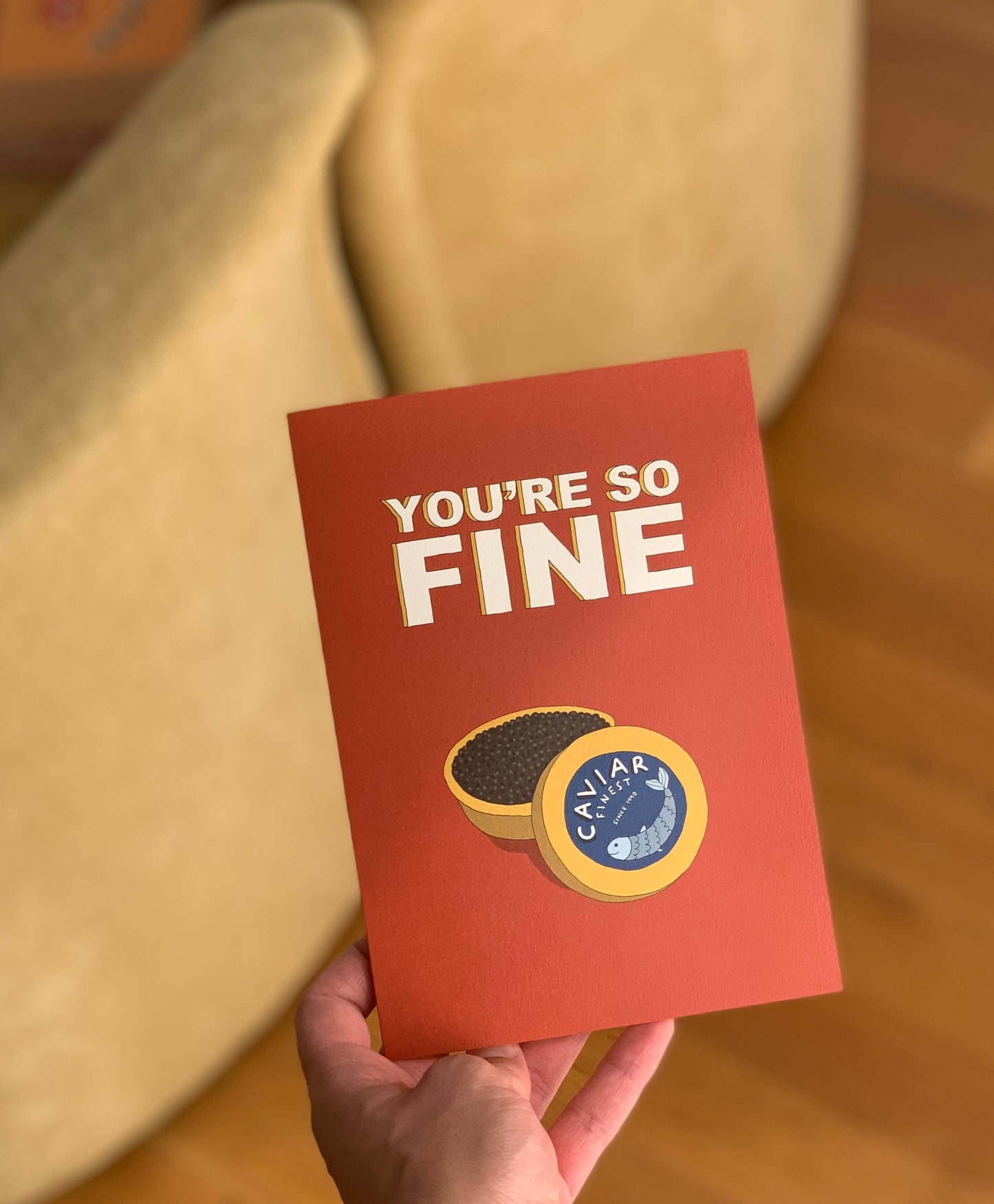 Caviar greeting card -- deep brown/red card with a gold tin of caviar on it and text that reads "You're So Fine" in bold, block letters. 
