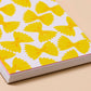 close up of small, spiral bound notebook with a farfalle pasta design 
