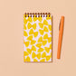 image of the farfalle pocket notebook with a pen next to it for size comparison 