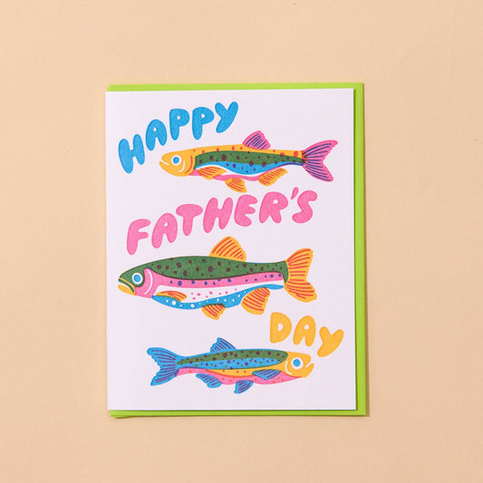 Father's Day card with colorful fish illustrations on a beige background