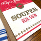 Get well card with 'Hope you feel Souper Real Soon' text on a wooden surface