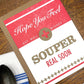 Get well card with text 'Hope you feel souper real soon' on a wooden surface