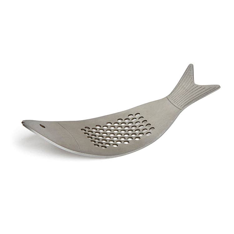 Fish-shaped metal garlic press on a white background
