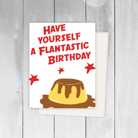 Greeting card with a flan illustration on it and text in red that reads "Have yourself a flantastic birthday" 