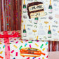 cake slice and hot dog gift tag stickers on festive wrapped gifts 
