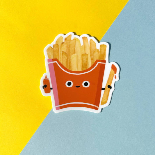 Cartoon-style French fries in a red box with a face, holding a ketchup squeeze bottle and ketchup dipped fry, on a yellow and blue background