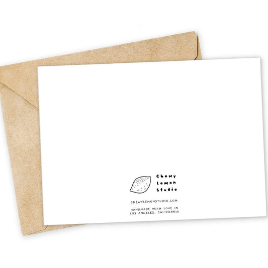 White card with brown envelope on a white background