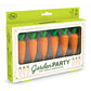 Box of carrot-shaped candles with green tops, labeled 'Garden Party' by Fred.