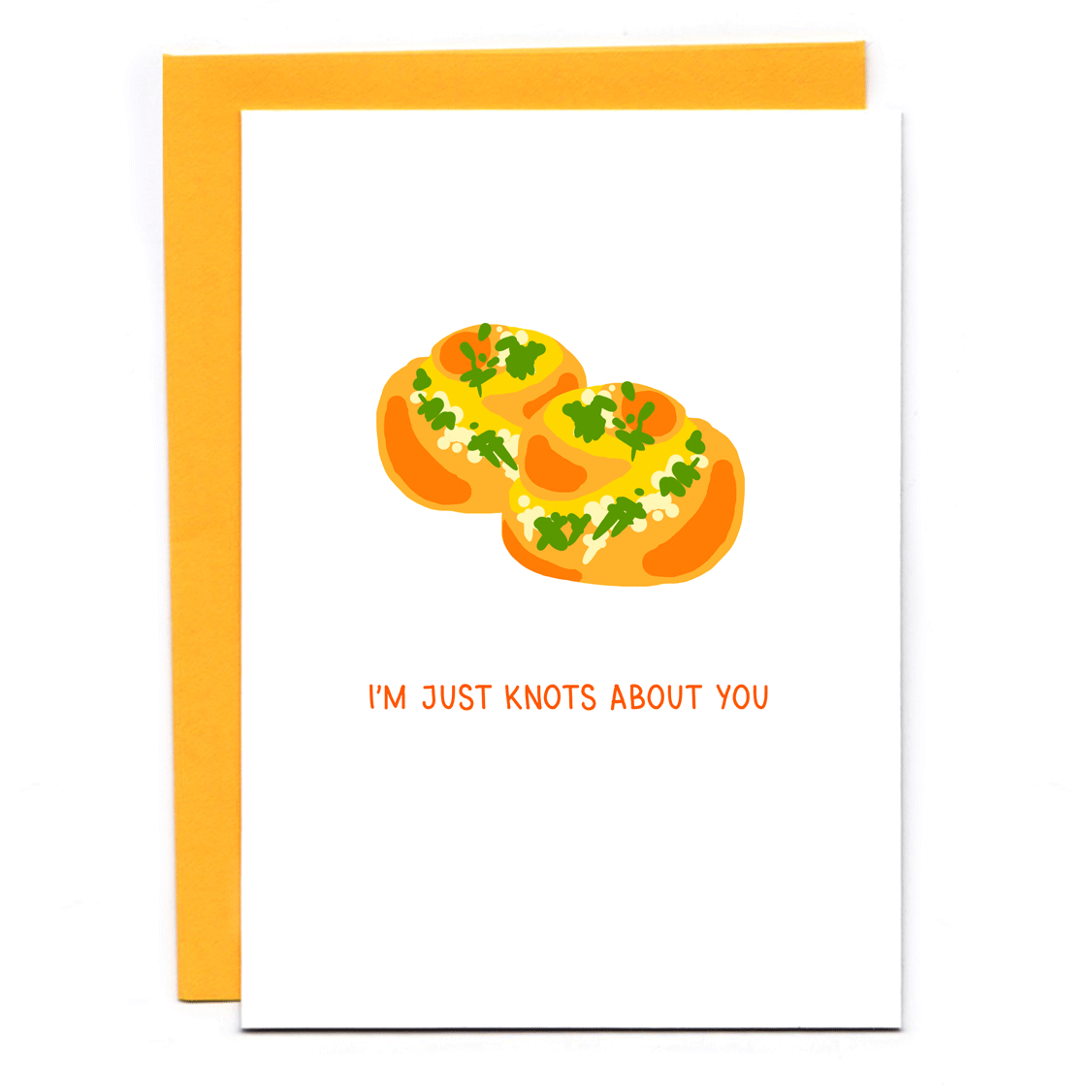 Punny greeting card with two cheesy, herbed garlic knots and text that reads: I'm just knots about you. Orange envelope.