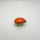 Small ceramic shrimp sushi with a smiling face on a white background