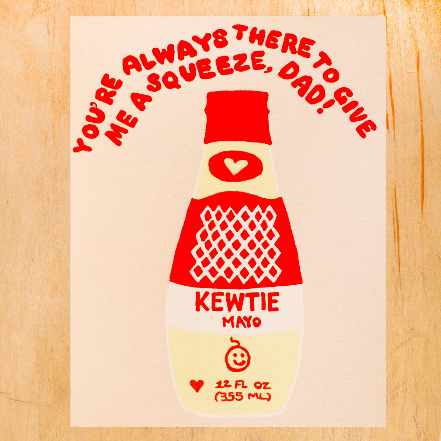 Father's day card with an illustration of a bottle of Japanese Kewpie mayo. Text above reads "You're always there to give me a squeeze, Dad!" 