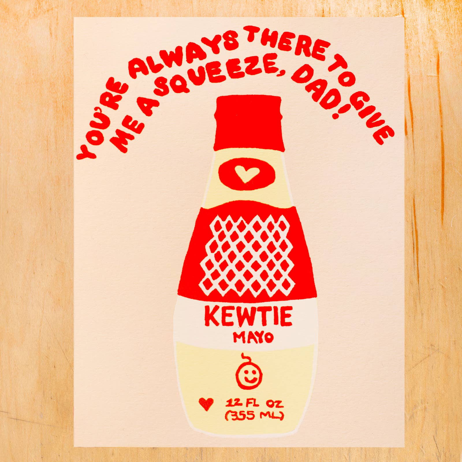 Father's day card with an illustration of a bottle of Japanese Kewpie mayo. Text above reads "You're always there to give me a squeeze, Dad!" 