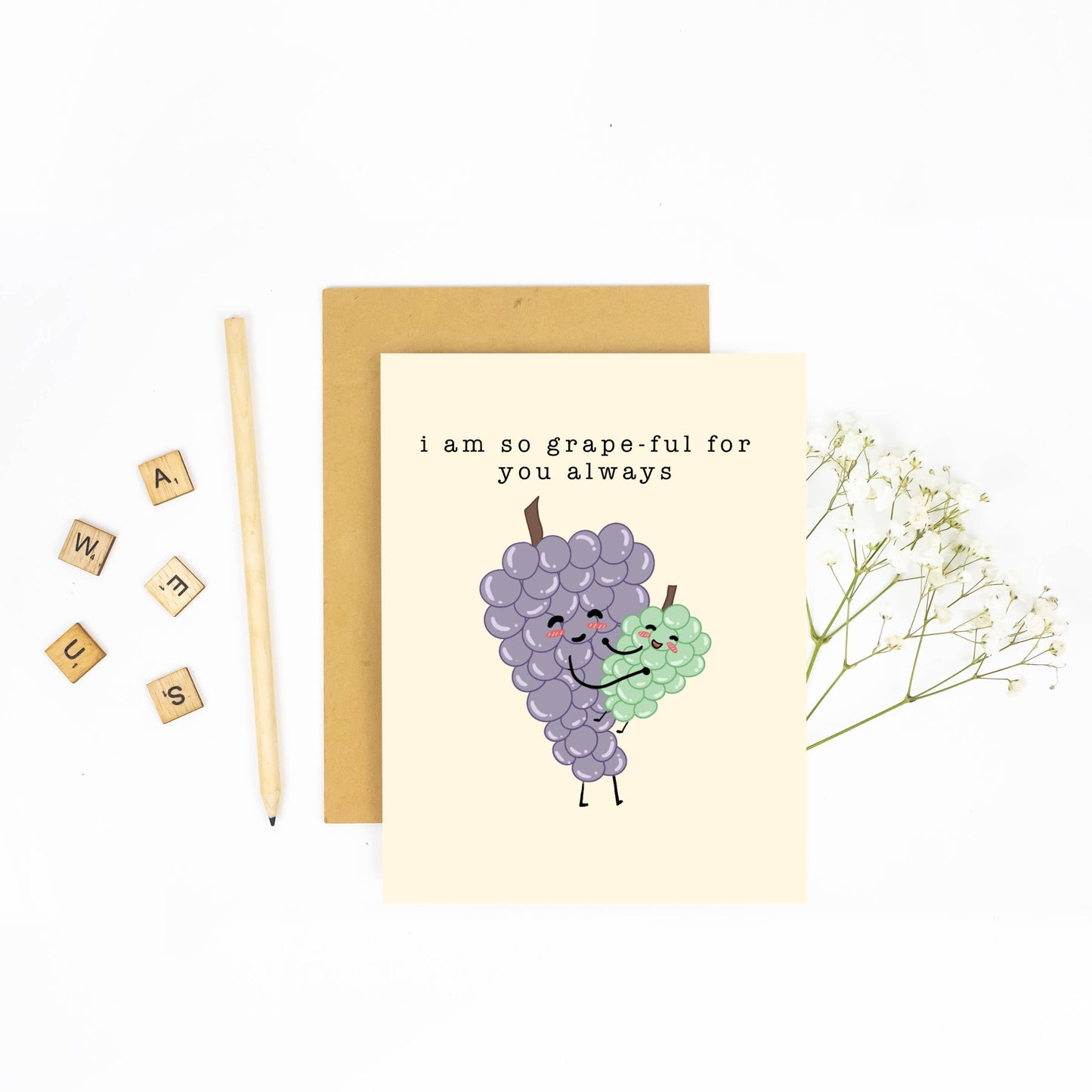 Greeting card with grapes illustration and text 'i am so grape-ful for you always' on a white background.