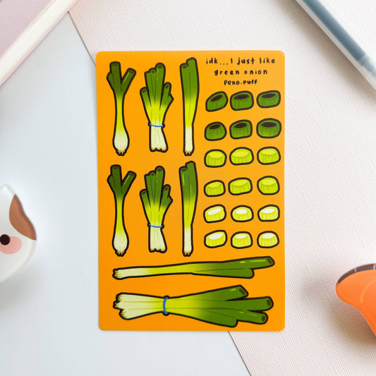 Sticker sheet with green onion illustrations on an orange background
