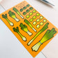 Sticker sheet of green onion stickers on an orange background