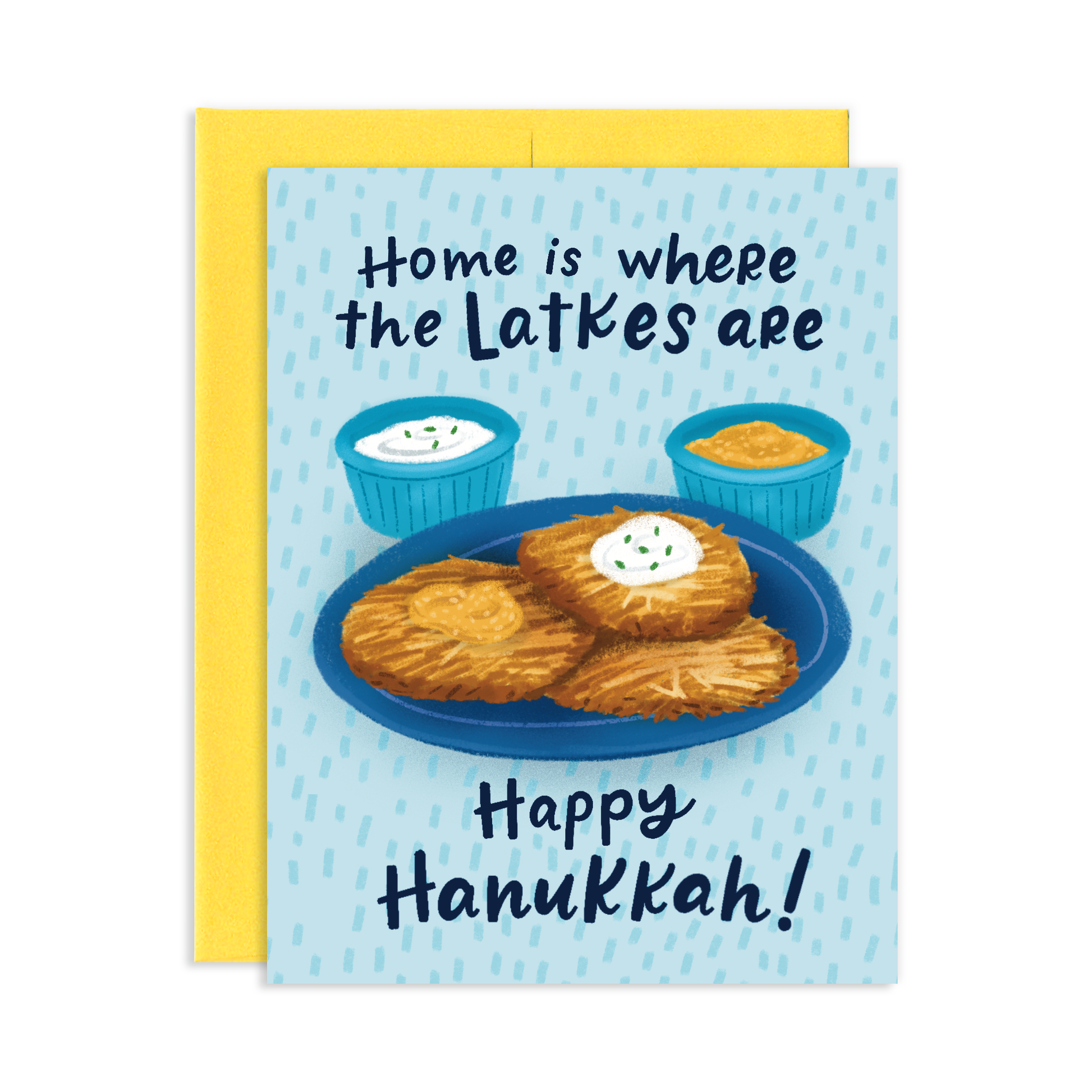 hanukkah greeting card with a plate of 3 latkes, paired with a dollop of sour cream and apple sauce. Text reads "Home is where the latkes are. Happy Hanukkah!" 