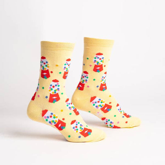 yellow socks with a red gumball machine and colorful gumballs all over it 