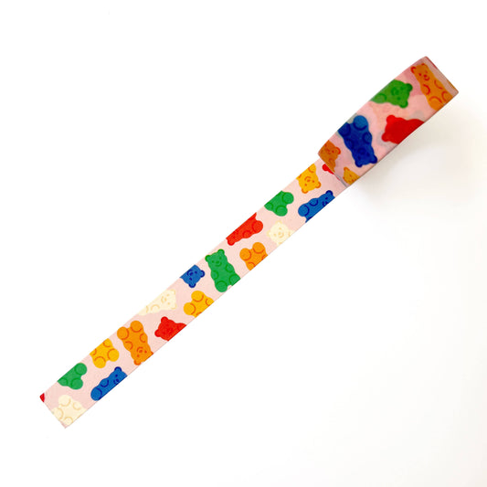 Colorful gummy bear-patterned ruler on a white background