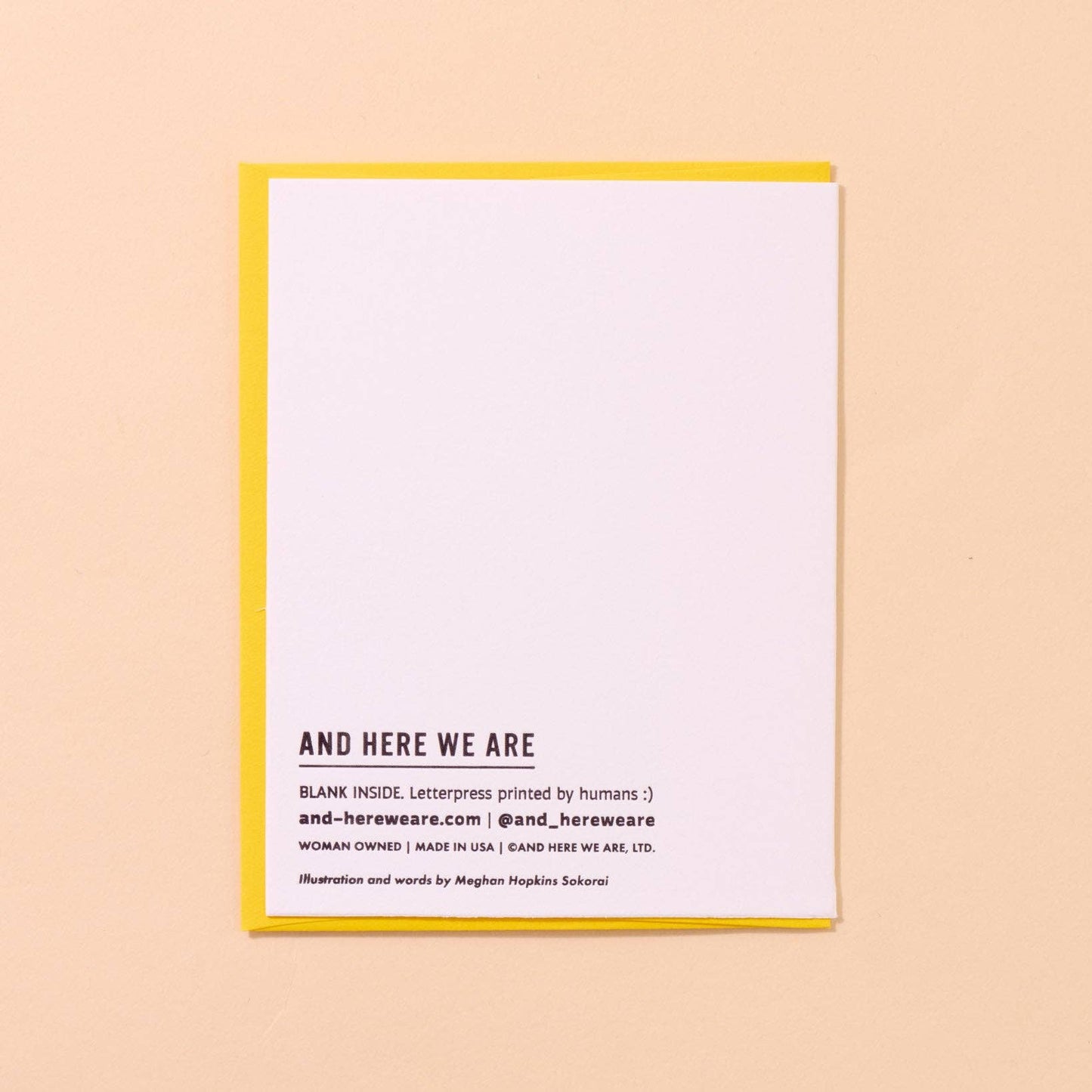 White card with black branding text on a beige background