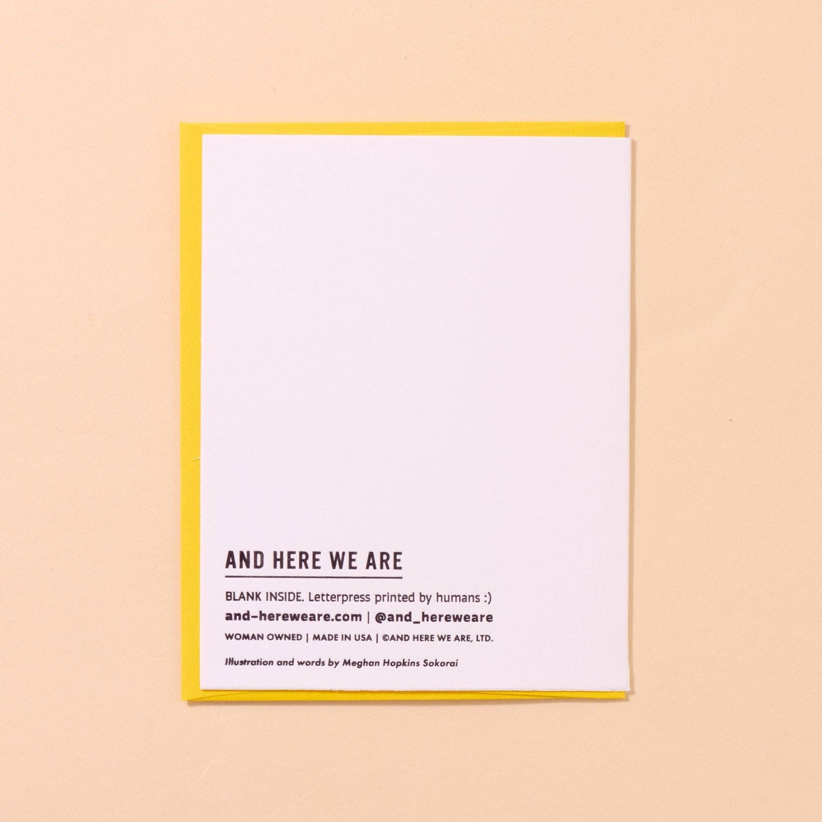 White card with black branding text on a beige background
