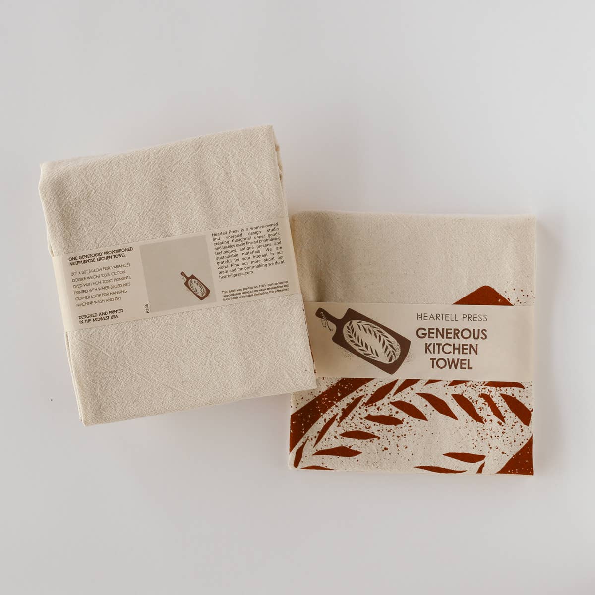 kitchen towel designed with a loaf of bread on a bread board in eco friendly band packaging