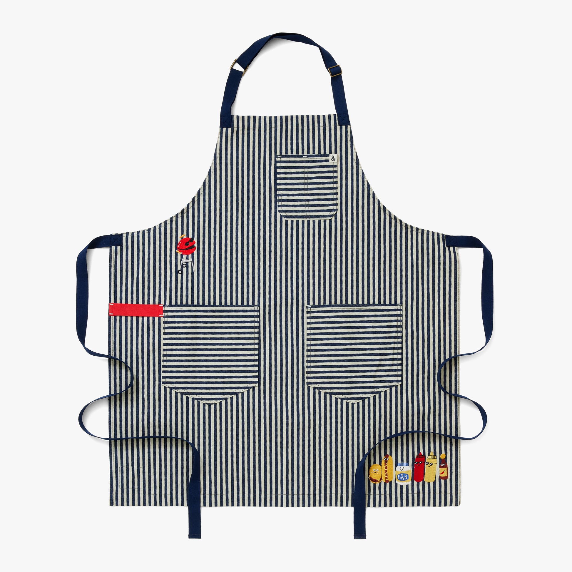 Palm striped apron body, navy straps, a red towel loop, and delectable embroidery featuring a charcoal grill, hamburger, hotdog, mayo, ketchup, mustard, and hot sauce.