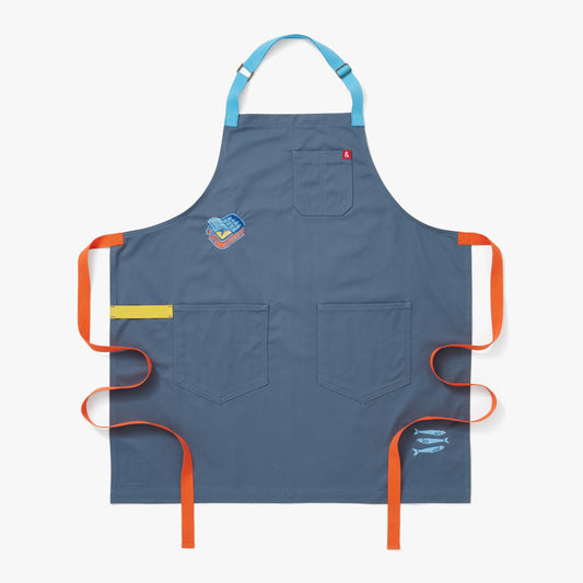Cotton Chino Twill Blue Moss apron body with sky blue, dandelion, and tangerine straps. The apron features four embroidered sardines in their cute tin at the waist and three fishy fish on the loose at the hem. 